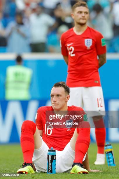 Phil Jones of England sits on the pitch after the 2018 FIFA World Cup Russia Play-Off for Third Place between Belgium and England at the Saint...