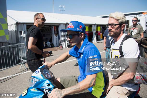 Andrea Iannone of Italy and Team Suzuki ECSTAR rides the scooter in paddock at the end of the qualifying practice during the MotoGp of Germany -...