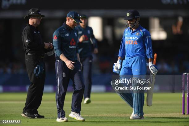 India batsman MS Dhoni wanders off after being dismissed during the 2nd ODI Royal London One Day International match between England and India at...