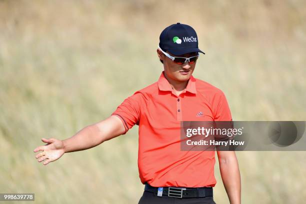 Haotong Li of China reacts to a missed par putt on hole ten during day three of the Aberdeen Standard Investments Scottish Open at Gullane Golf...
