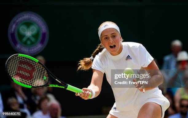 Jelena Ostapenko of Latvia in action against Angelique Kerber of Germany in the ladies' semi finals at the All England Lawn Tennis and Croquet Club...