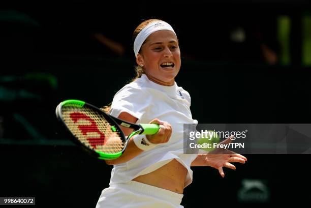 Jelena Ostapenko of Latvia in action against Angelique Kerber of Germany in the ladies' semi finals at the All England Lawn Tennis and Croquet Club...