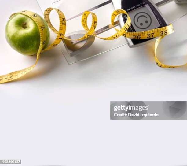 face scale with apple and tape measure square composition top - white eggplant stock pictures, royalty-free photos & images