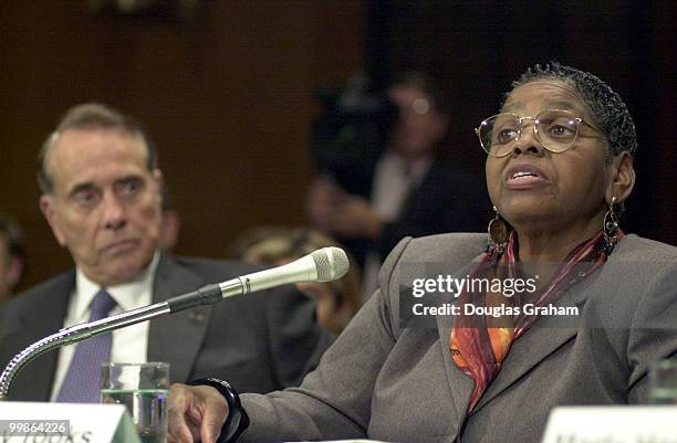 Bob Dole listens to Ruby Tooks before the start of the hearing on hospice care. Mrs. Tooks, who's mother died three weeks ago, testified about how...