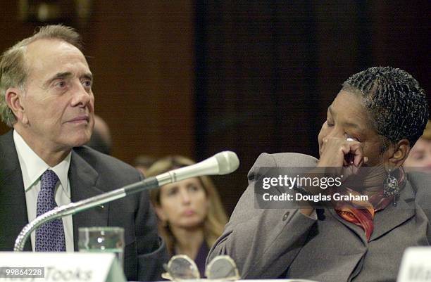 Bob Dole listens to Ruby Tooks during the hearing on hospice care. Mrs. Tooks, who's mother died three weeks ago, testified about how hospice helped...