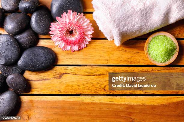 stones with towel and bath salts top view - bath salt ストックフォトと画像