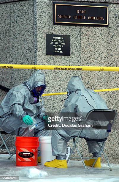 Anthrax Clean-up continues at the Hart Senate Office Building as workers dressed in protective clothing go through samples.