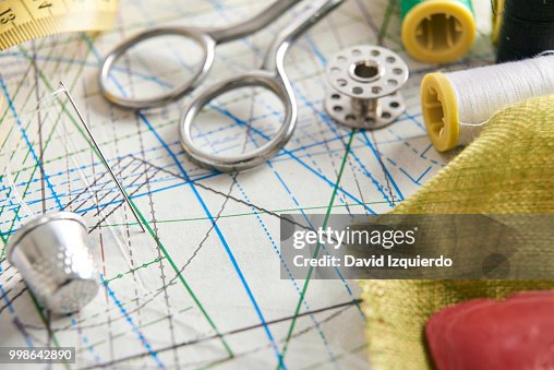 Tailoring tools on clothing pattern elevated view Tailoring tools on clothing pattern elevated view