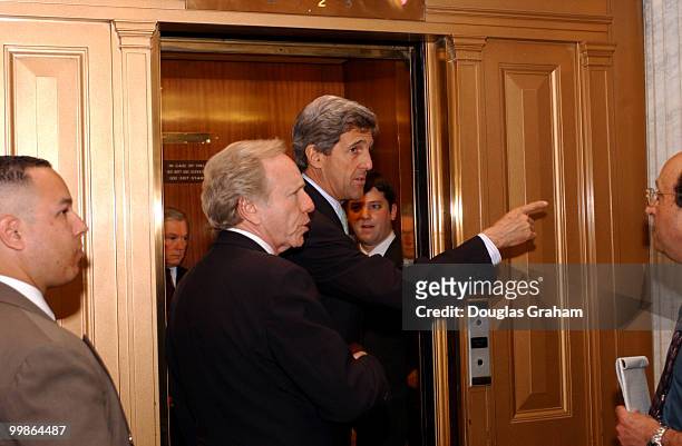 Joseph Lieberman, D-CT., and John Kerry, D-Mass., are greeted by environmental lobbyist outside the Senate Floor after the cloture vote on drilling...