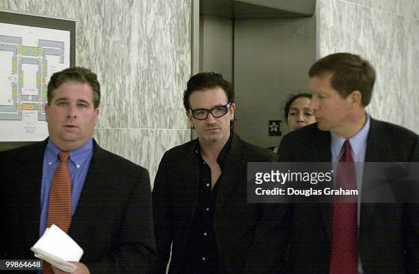 John R. Kasich, R-Ohio, and U2's lead singer Bono in the halls of the Rayburn House Office Building.