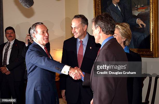 Mayor elect of New York Mike Bloomberg greets Majority Leader Tom Daschle, D-S.D., during his tour of the U.S. Capitol.