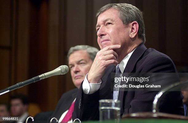 Christopher S. Bond, R-Mo., and John Ashcroft listen to opening statements during Ashcroft's conformation hearing for attorney general before the...
