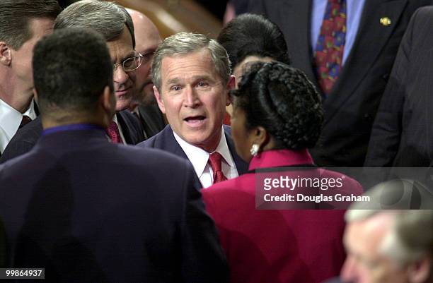 President Bush is greeted by Jesse L. Jackson Jr., D-Ill., and Sheila Jackson-Lee, D-Texas, after his address to the Joint Session of Congress.