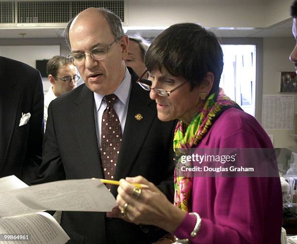 Martin Frost, D-Texas, and Rosa DeLauro, D-Ct., before the start of the press conference on the budget, look over the two pages that were left out of...