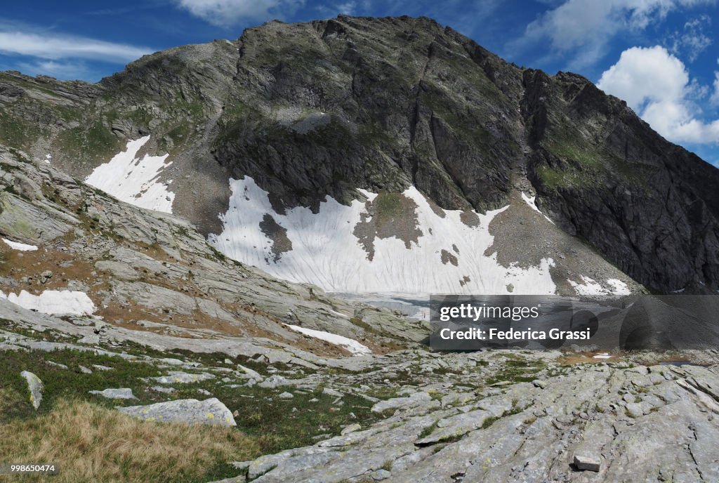 Rocky Landscape With Frozen Alpine Lake In Bognanco Valley