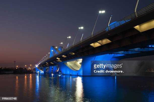 sheikh zayed bridge at night, abu dhabi, uae - zayed stock-fotos und bilder