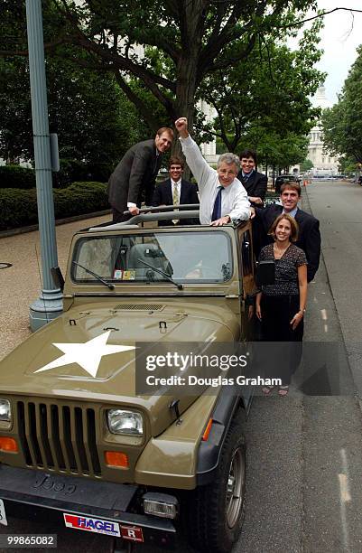 Sen. Hagel had his jeep painted to look like an army jeep as a suprise for his son Ziller, 8. From left to right in the photo are: Jason Wiggins ,...