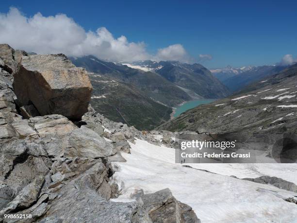 panoramic view of lago smeraldo (emerald lake) at monte moro pass - gneiss stock pictures, royalty-free photos & images