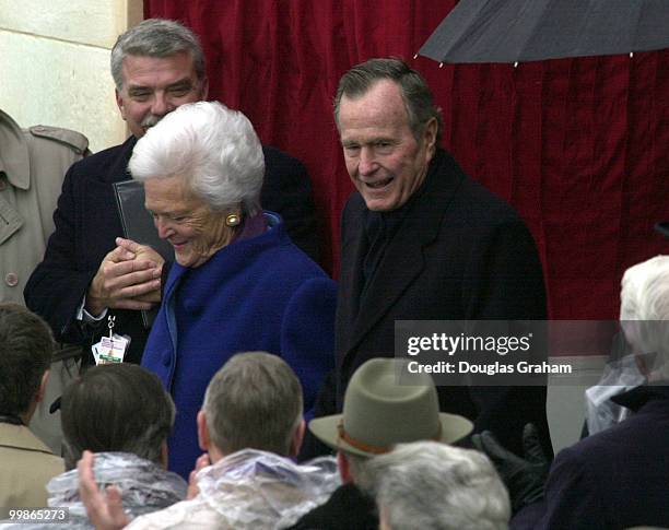 Former President George Bush Sr. And former First Lady Barbara Bush enter the West Front of the u.S. Capitol for the 2001 Inauguration of George W....