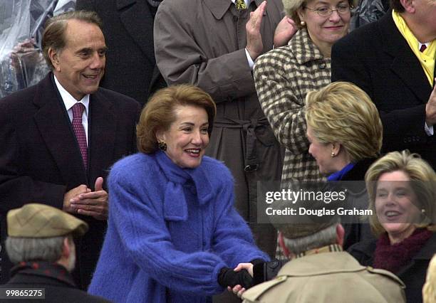 Bob Dole and Elizabeth Dole greet Hillary Clinton and Tipper Gore as they enter the West Front of the U.S. Capitol for the 2001 Inauguration of...