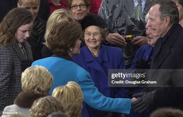 Former President George Bush Sr. And former First Lady Barbara Bush greet Laura Bush and family as they enter the West Front of the U.S. Capitol for...