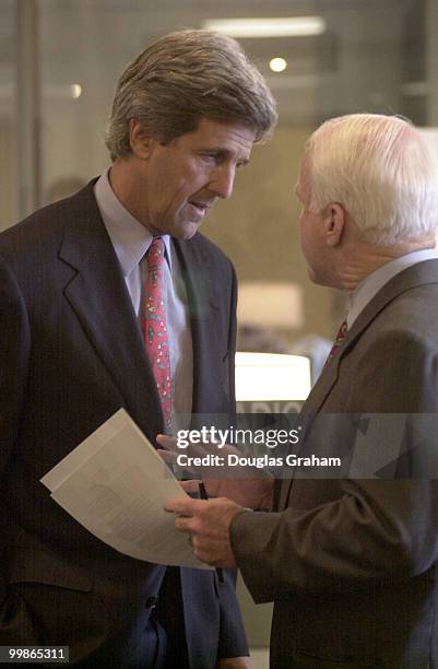 John F. Kerry, R-Mass., and John McCain, R-Ariz., talk outside the Senate Press gallery before the start of the internet privacy press conference.