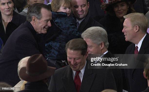 Former President George Bush Sr. And former First Lady Barbara Bush greet President Bill Clinton and Vise President Al Gore as they enter the West...