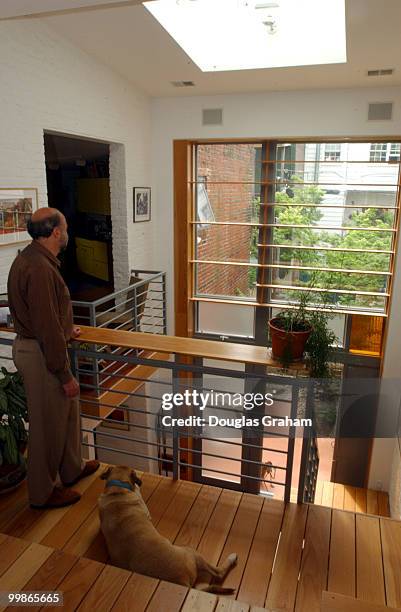 David Winer and "Bright Moment" enjoys the view out on to his court yard at his house on 21 Gessford Ct. Winer's home is hopefully on the list of...