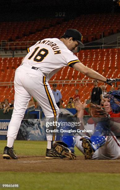 Rick Santorum pats Tim Holdens on the head after knocking him to the ground during the 45th Annual Roll Call Congressional Baseball Game at RFK...