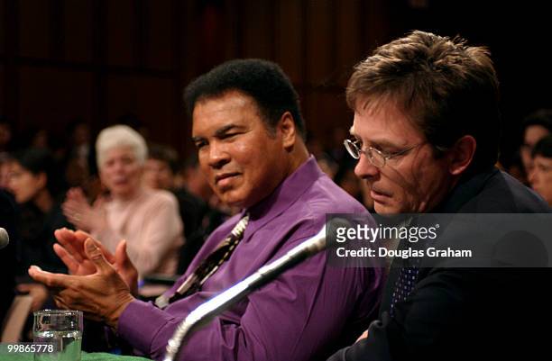 Muhammad Ali, former heavyweight boxing champion applauds Michael Fox, actor/founder, Michael Fox Foundation for Parkinson's Research, after his...