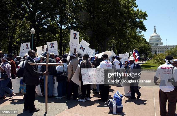 Haitians protest in the upper Senate Park. Specifically, the CBC Haiti task Force is sending a strong message to president Bush and the...