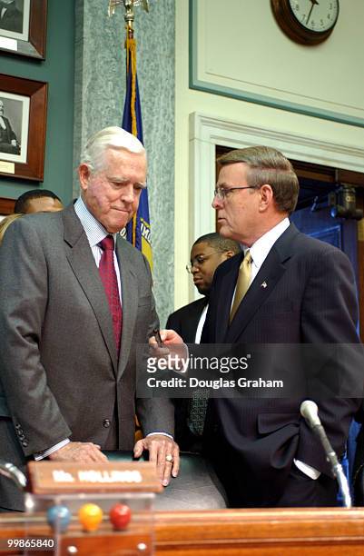 Chairman Ernest F. Hollings, D-S.C., and Byron L. Dorgan, D-N.D., talk before the start of the Commerce, Science and Transportation Committee hearing...