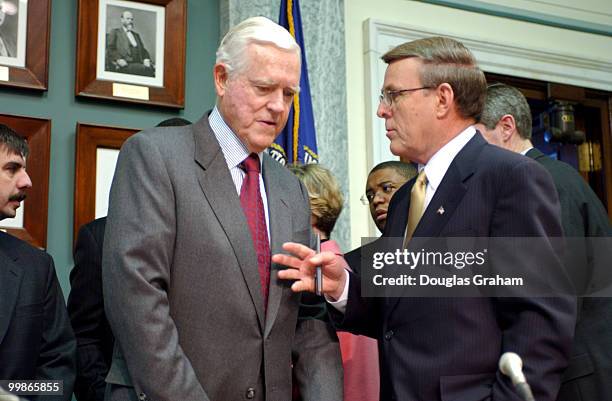 Chairman Ernest F. Hollings, D-S.C., and Byron L. Dorgan, D-N.D., talk before the start of the Commerce, Science and Transportation Committee hearing...