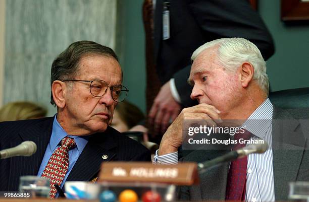 Ted Stevens, R-Alaska, and Chairman Ernest F. Hollings, D-S.C., talk during the Commerce, Science and Transportation Committee hearing on the vote on...