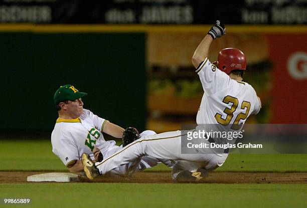 Ben Chandler tries in vein to tag Graham Barrett as he slides into 2nd base during the 45th Annual Roll Call Congressional Baseball Game at RFK...