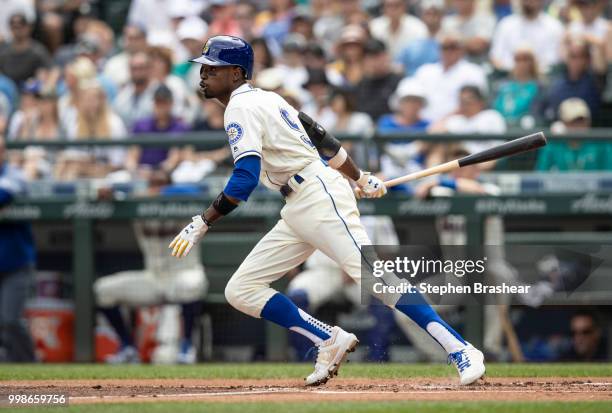 Dee Gordon of the Seattle Mariners hits a single during a game against the Colorado Rockies at Safeco Field on July 8, 2018 in Seattle, Washington....