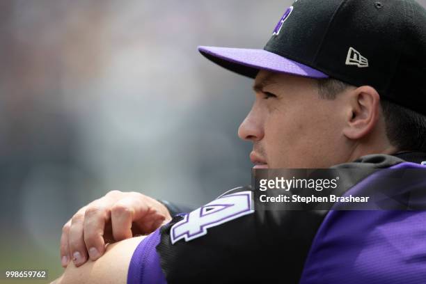 Tony Wolters of the Colorado Rockies watches play from the dugout during a game against the Seattle Mariners at Safeco Field on July 8, 2018 in...