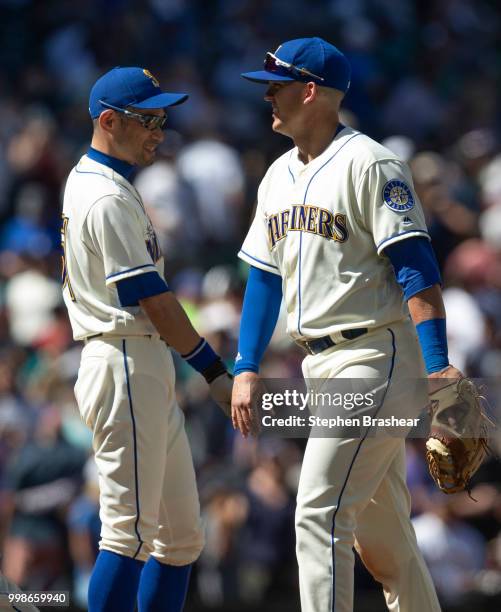 Ichiro Suzuki of the Seattle Mariners and Ryon Healy of the Seattle Mariners celebrate after a game against the Colorado Rockies at Safeco Field on...