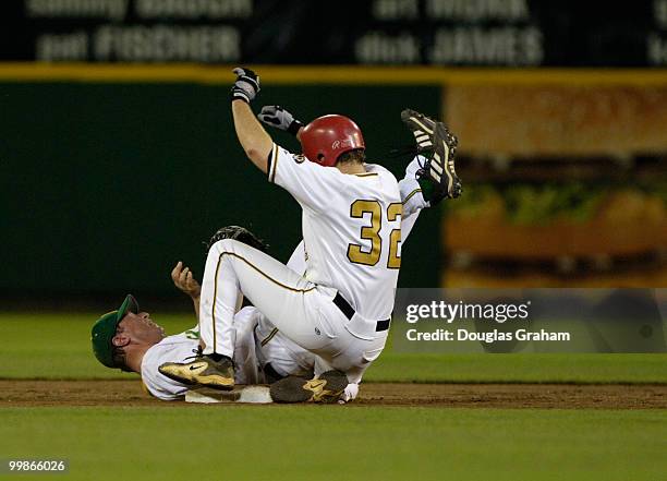 Ben Chandler tries in vein to tag Graham Barrett as he slides into 2nd base during the 45th Annual Roll Call Congressional Baseball Game at RFK...