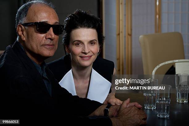 Iranian director Abbas Kiarostami and French actress Juliette Binoche pose during the 63rd Cannes Film Festival on May 18, 2010 in Cannes. AFP PHOTO...