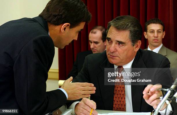 Billy Tauzin, R-La., talks with council before the start of the Subcommittee on Oversight and Investigations of the destruction of Enron-related...