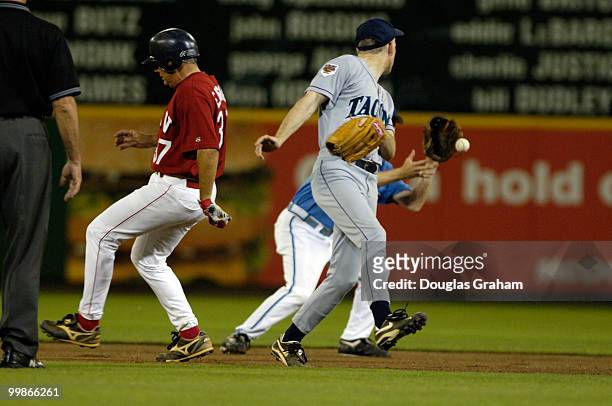 John Ensign steals 2nd base as Adam Smith and Mike McIntyre try to handle a loose ball during the 45th Annual Roll Call Congressional Baseball Game...