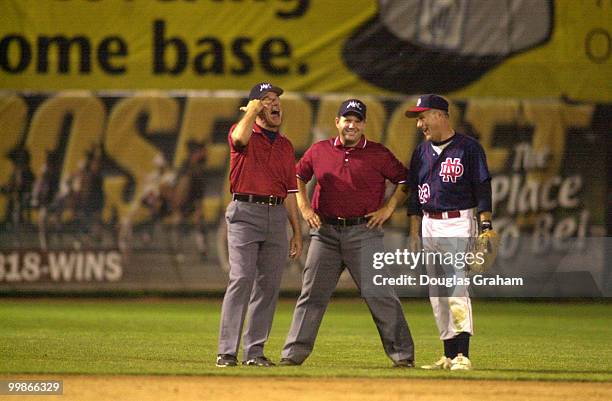 Umpires share a laugh with Brian Baird, D-Wash., during the 40th Annual Roll Call Congressional Baseball Game.