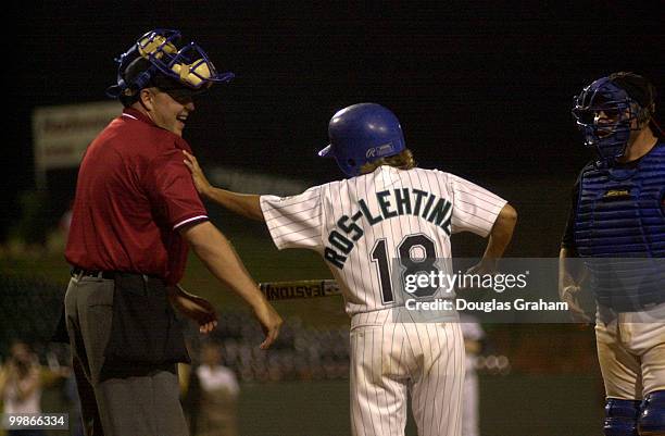 Home Plate Umpire takes alittle light hearted ribbing from IIeana Ros-Lehtinen, R-Fl., after she struck-out during the 40th Annual Roll Call...