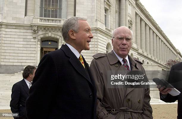 Orrin G. Hatch, R-Utah, and Patrick J. Leahy, D-Vt., walk from the Russell Senate Office Building to the Supreme Court were the Bush appeal of the...