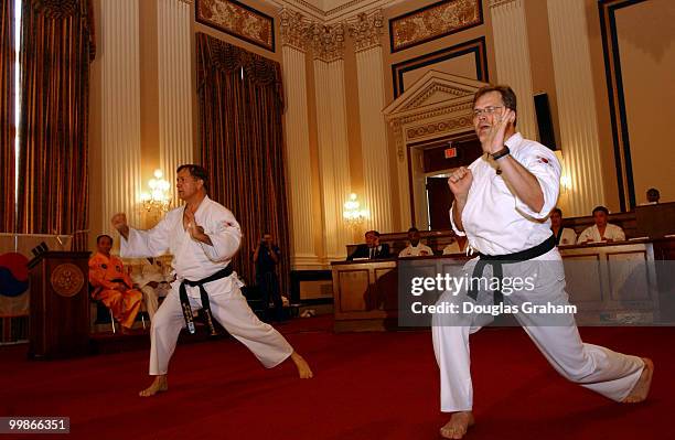 Nick Smith, R-Mich., and Bob Schaffer, R-Colo., during there black belt test in the Cannon Caucus room.