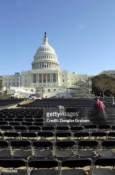 Workers set up the sea of chairs to be used during the Presidential Inauguration on the West Front of the U.S. Capitol.