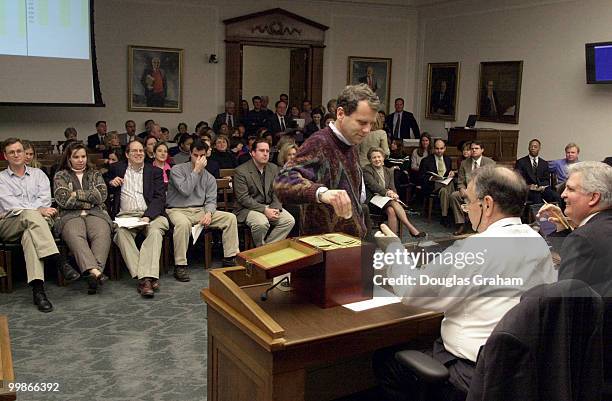 Sherrod Brown, R-Ohio, draws his lottery number and hands it to Robert Miley, House Superintendent for her new diggs on the hill.