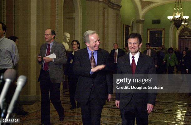 Joseph I. Lieberman, D-Conn., and Tom Daschle, D-S.D., leave the democratic caucus luncheon.