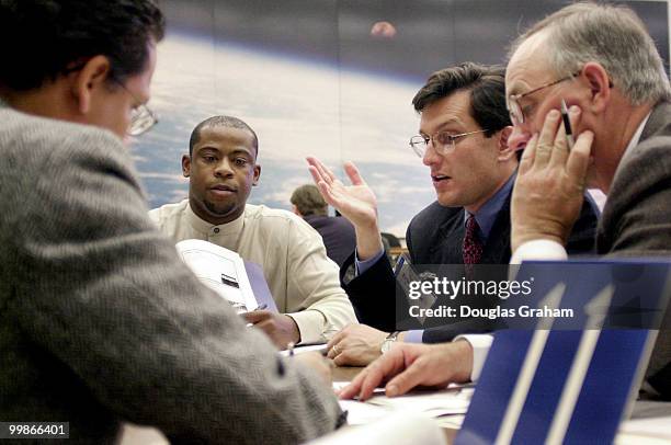 Eric Cantor, R-Va., works out the finial details of his new office and the layout with members of his move coordination team.